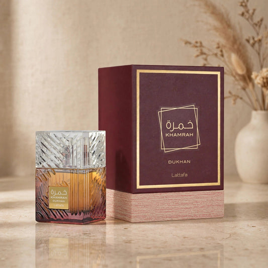 Lattafa Khamrah Dukhan Eau de Parfum bottle in warm setting