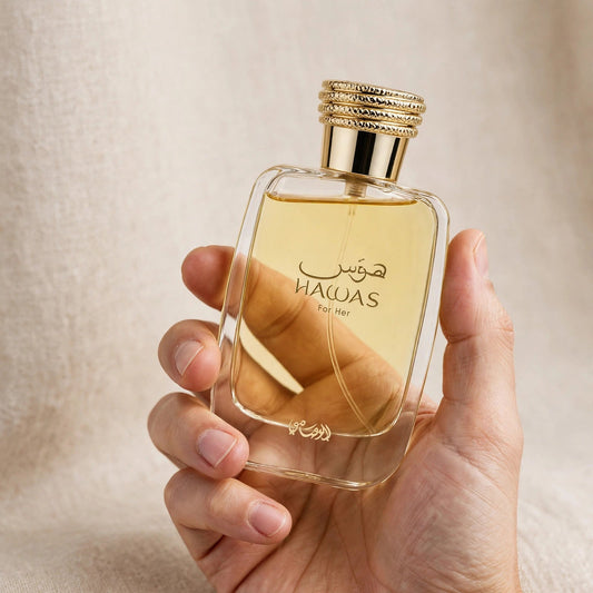 Hand holding Rasasi Hawas for Her EDP perfume bottle