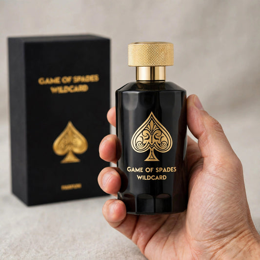 Hand holding Jo Milano Game of Spades Wildcard Parfum 100ml bottle