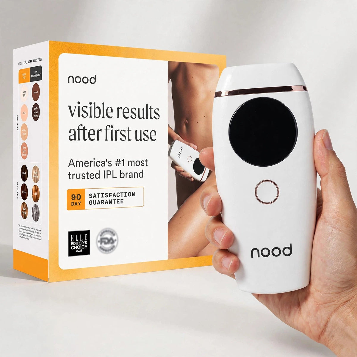 Hand holding the Nood The Flasher 2.0 IPL hair removal device