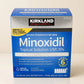 Kirkland Minoxidil 5% box in a cream studio setting