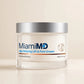 MiamiMD Age Defying cream jar in a cream studio