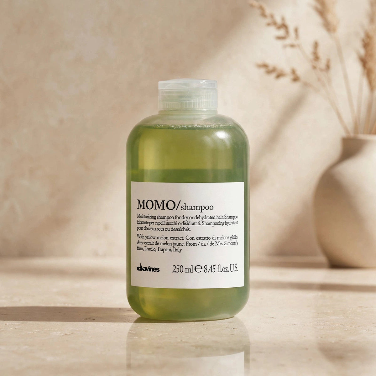 Davines MOMO moisturizing shampoo in a warm studio