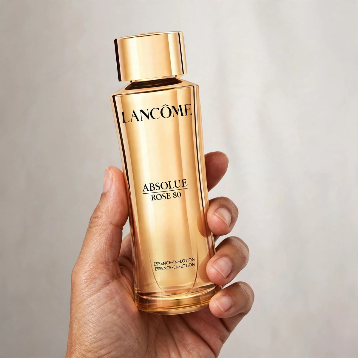 Lancôme Absolue Rose 80 Essence-in-Lotion held in hand
