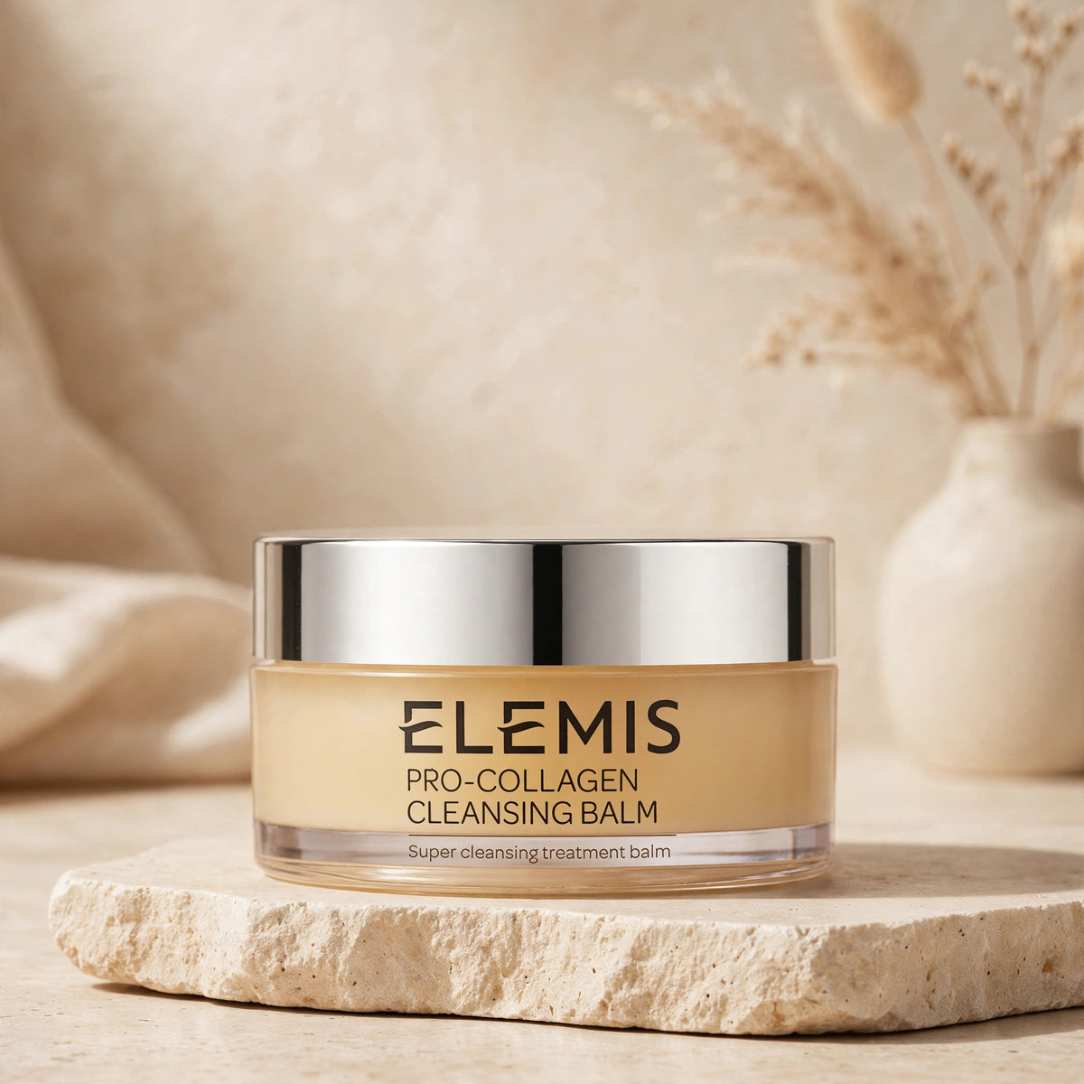 Elemis Pro-Collagen Cleansing Balm in warm beige studio setting