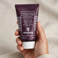 Sisley Black Rose Cream Mask held in hand