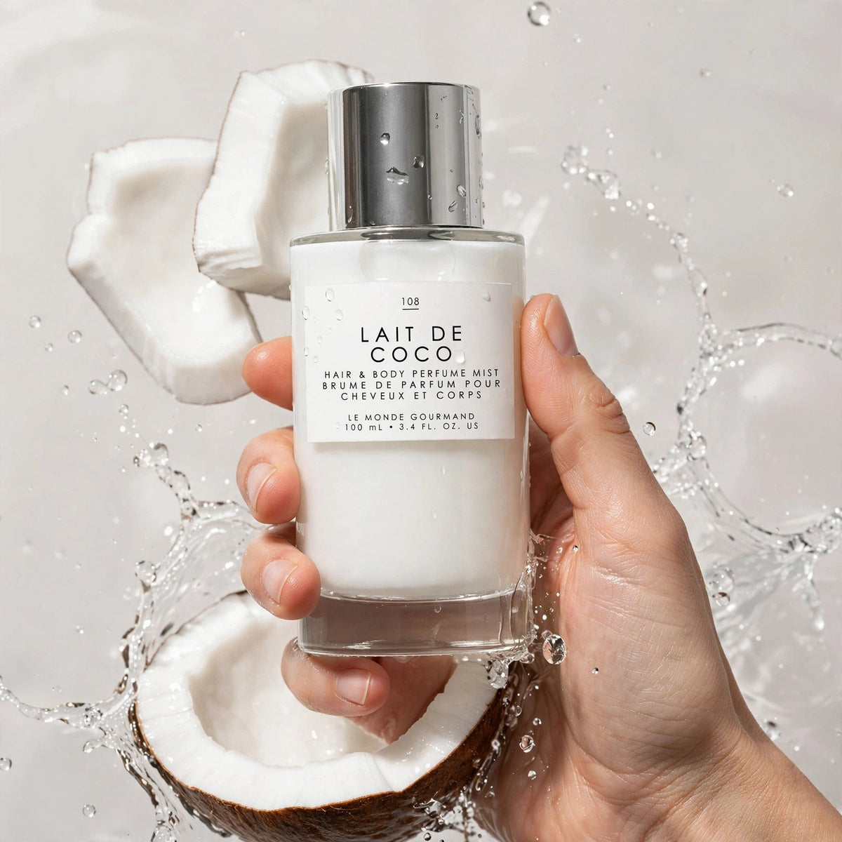 Hand holding Le Monde Gourmand Lait De Coco 108 bottle