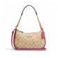 Coach Teri Shoulder Bag in signature canvas with gold and powder pink trim on white background