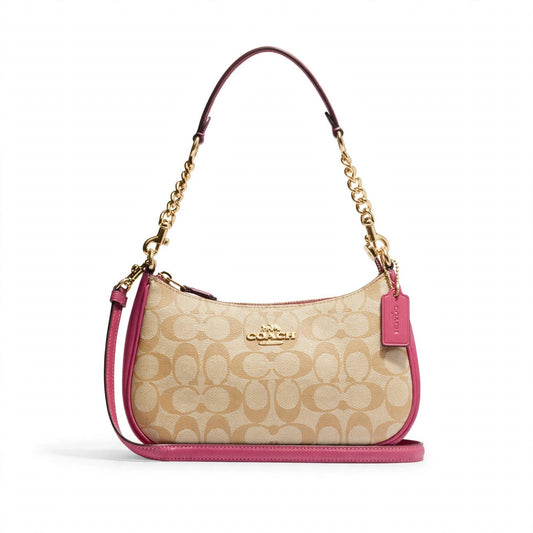 Coach Teri Shoulder Bag in signature canvas with gold and powder pink trim on white background