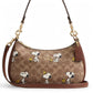 Coach x Peanuts Teri Shoulder Bag with Snoopy print on white background