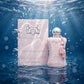 Parfums de Marly Delina Exclusif perfume submerged in clear water