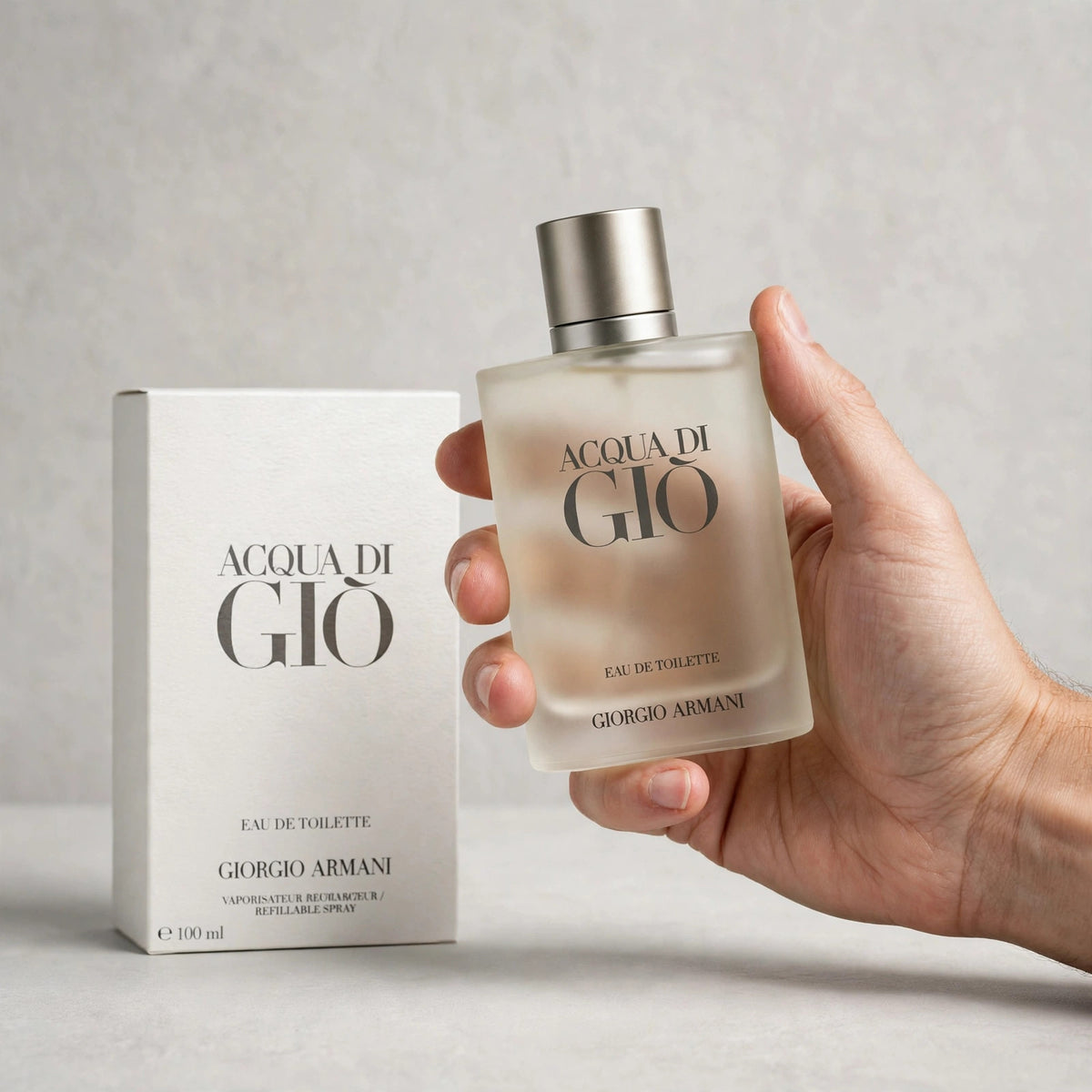 Acqua di Gio Eau de Toilette bottle held in hand