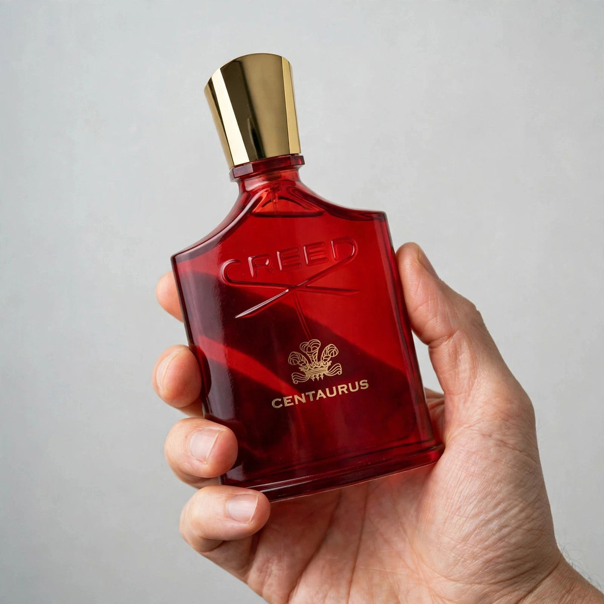Creed Centaurus Eau de Parfum 100ml / 3.4oz for Unisex — bottle and box held in hand