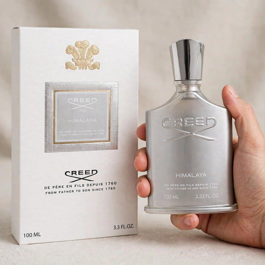 Creed Himalaya Eau de Parfum 100ml / 3.3oz for Men — bottle and box held in hand