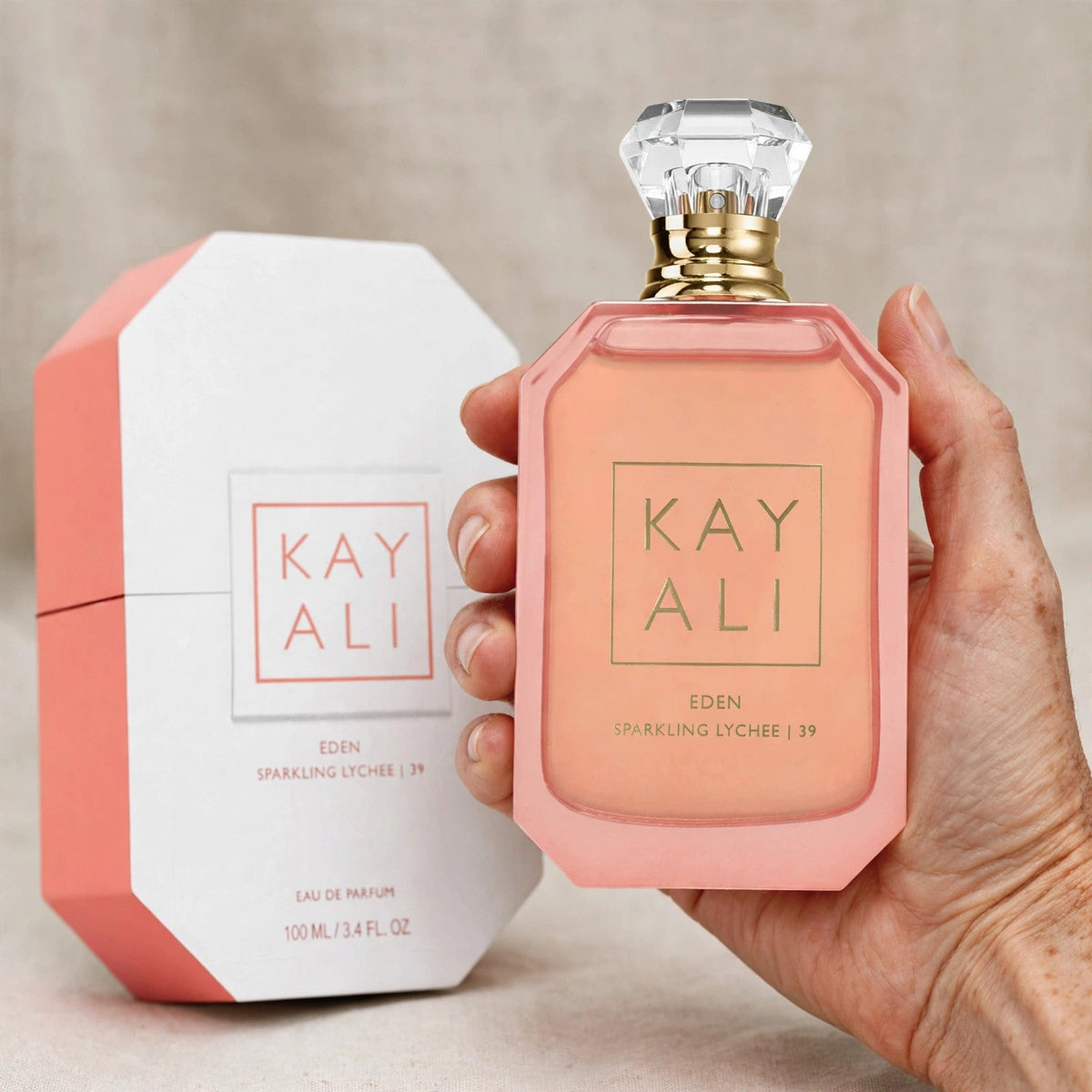 Kayali Eden Sparkling Lychee 39 Eau de Parfum 100ml / 3.4oz for Women — hand view