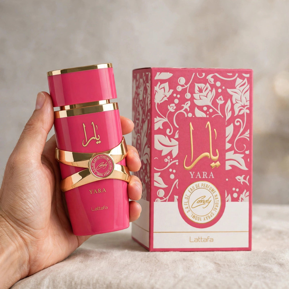 Lattafa Yara Candy Eau de Parfum bottle in hand setting