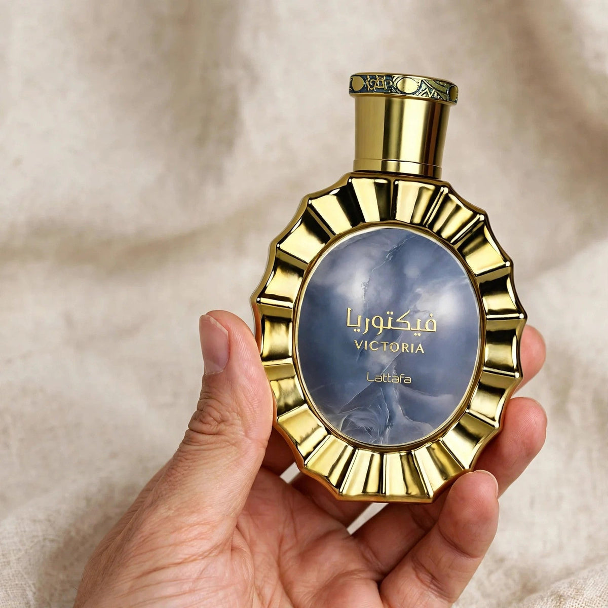 Lattafa Victoria EDP 100ml / 3.4oz for Unisex — hand-held shot