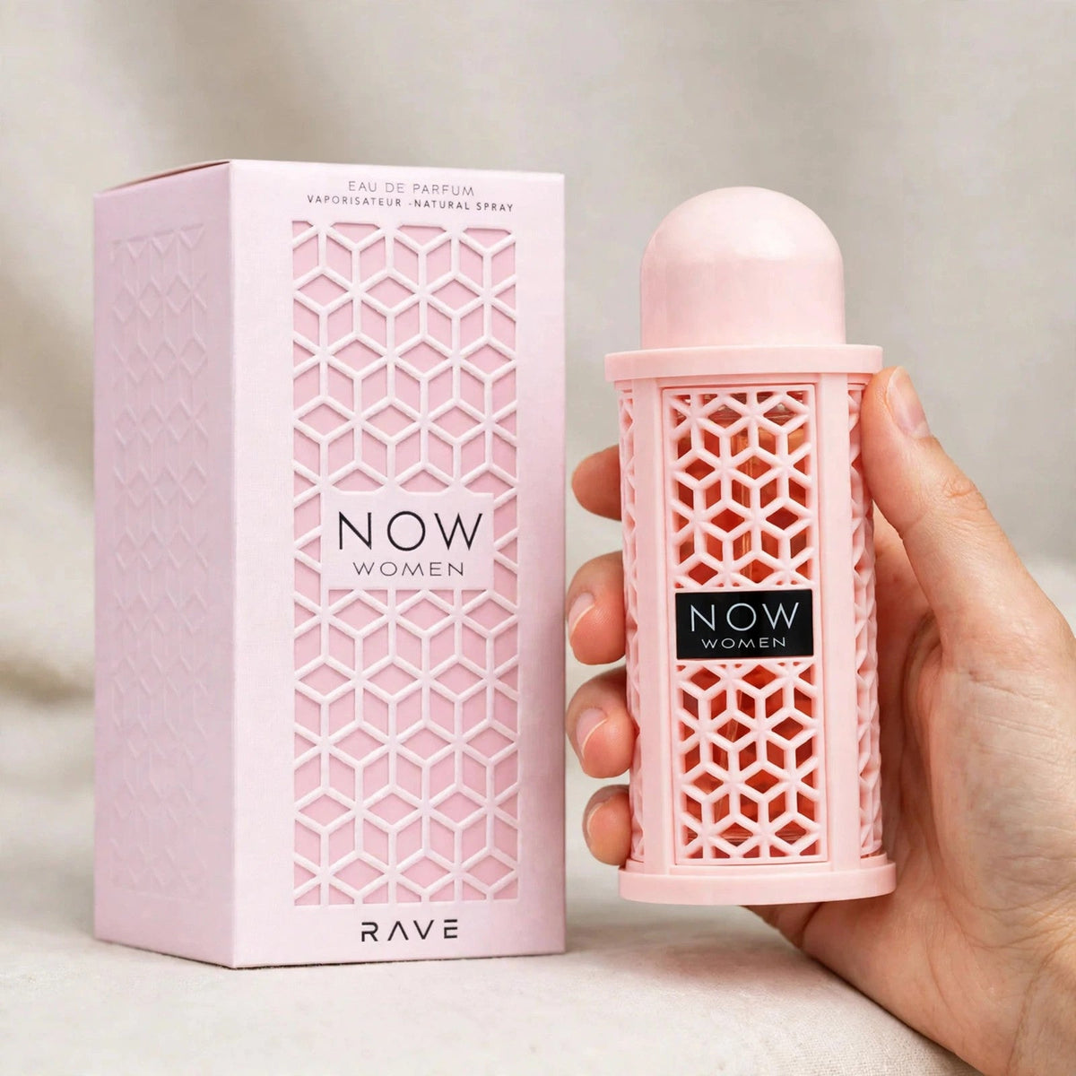 Lattafa Rave Now Eau de Parfum bottle in hand setting
