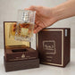 Lattafa Khamrah Qahwa Eau de Parfum bottle in hand setting