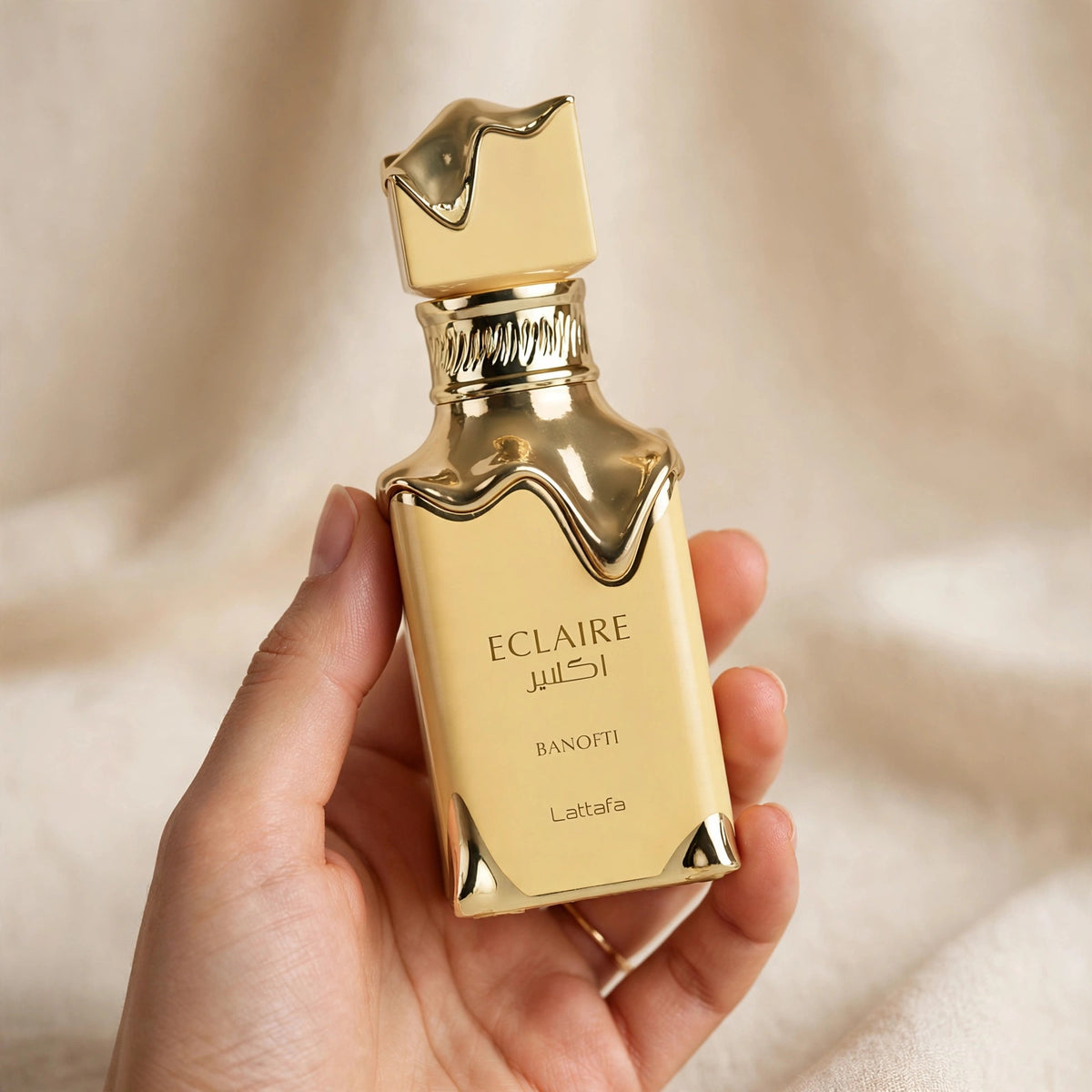 Lattafa Eclaire Banoffi Eau de Parfum 100ml for Unisex bottle and box held in hand