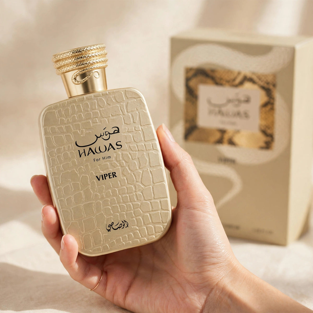 Rasasi Hawas Viper For Him Eau de Parfum 100ml for Men bottle and box held in hand