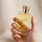 Hand holding Rasasi Hawas for Her EDP perfume bottle