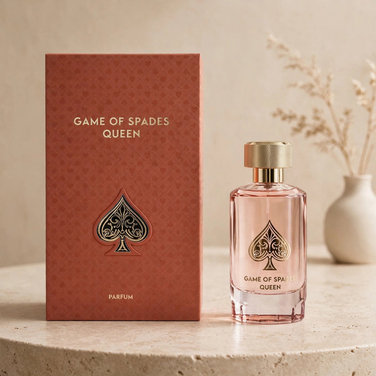 Jo Milano Game of Spades Queen Parfum 100ml bottle and box in warm beige studio