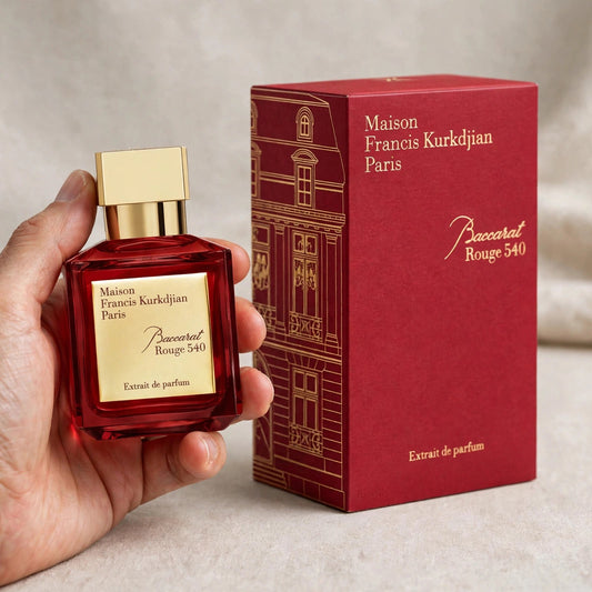 Hand holding Maison Francis Kurkdjian Baccarat Rouge 540 Extrait de Parfum 70ml bottle