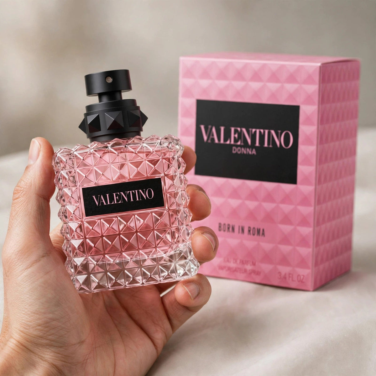 Valentino Donna Born In Roma Eau de Parfum 100ml bottle — held in hand