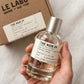 Le Labo The Noir 29 Eau de Parfum 100ml bottle held in hand