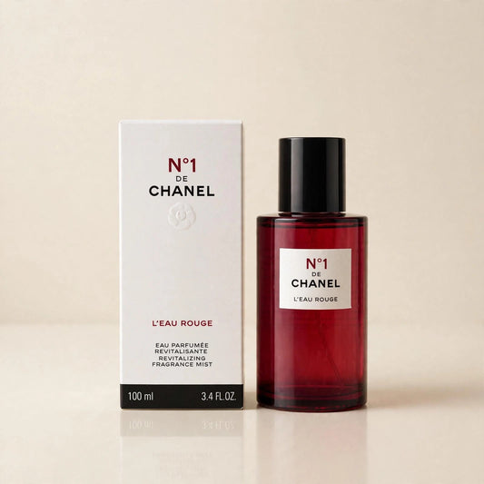 Chanel No 1 L'Eau Rouge mist in a cream studio setting