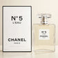 Chanel No 5 L'Eau EDT in a cream studio setting