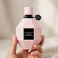Hand holding Viktor & Rolf Flowerbomb Extreme EDP Intense perfume bottle