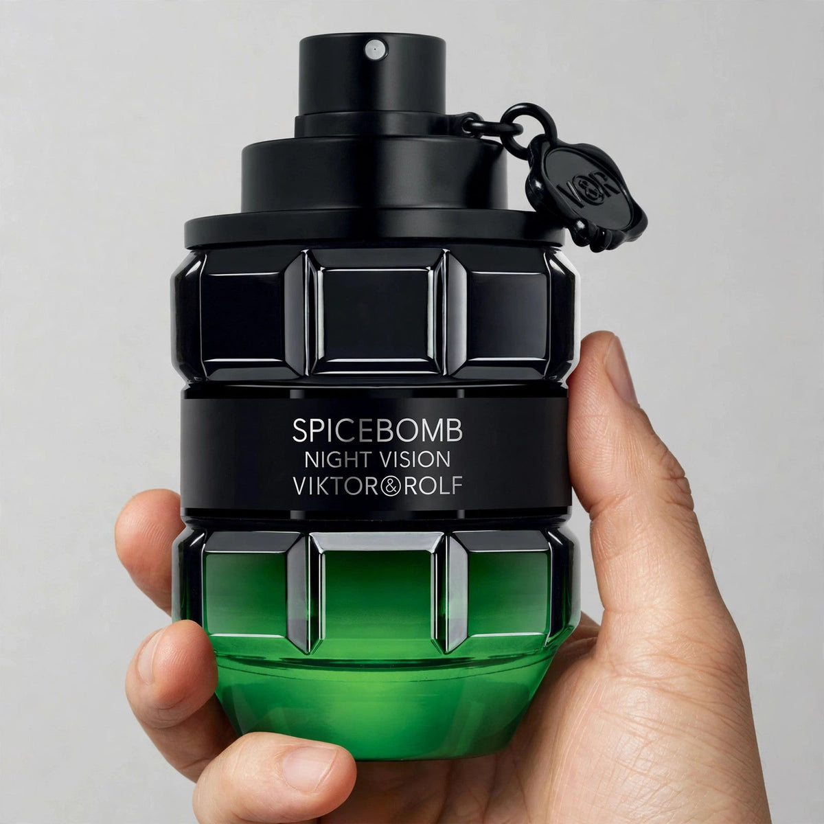 Hand holding Viktor & Rolf Spicebomb Night Vision EDT perfume bottle
