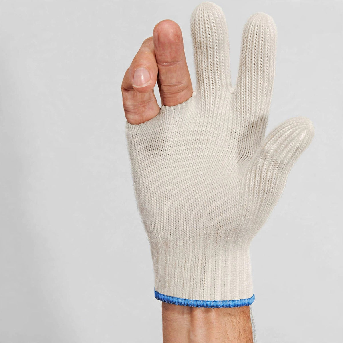 Hand wearing the Ove Glove heavy duty oven glove