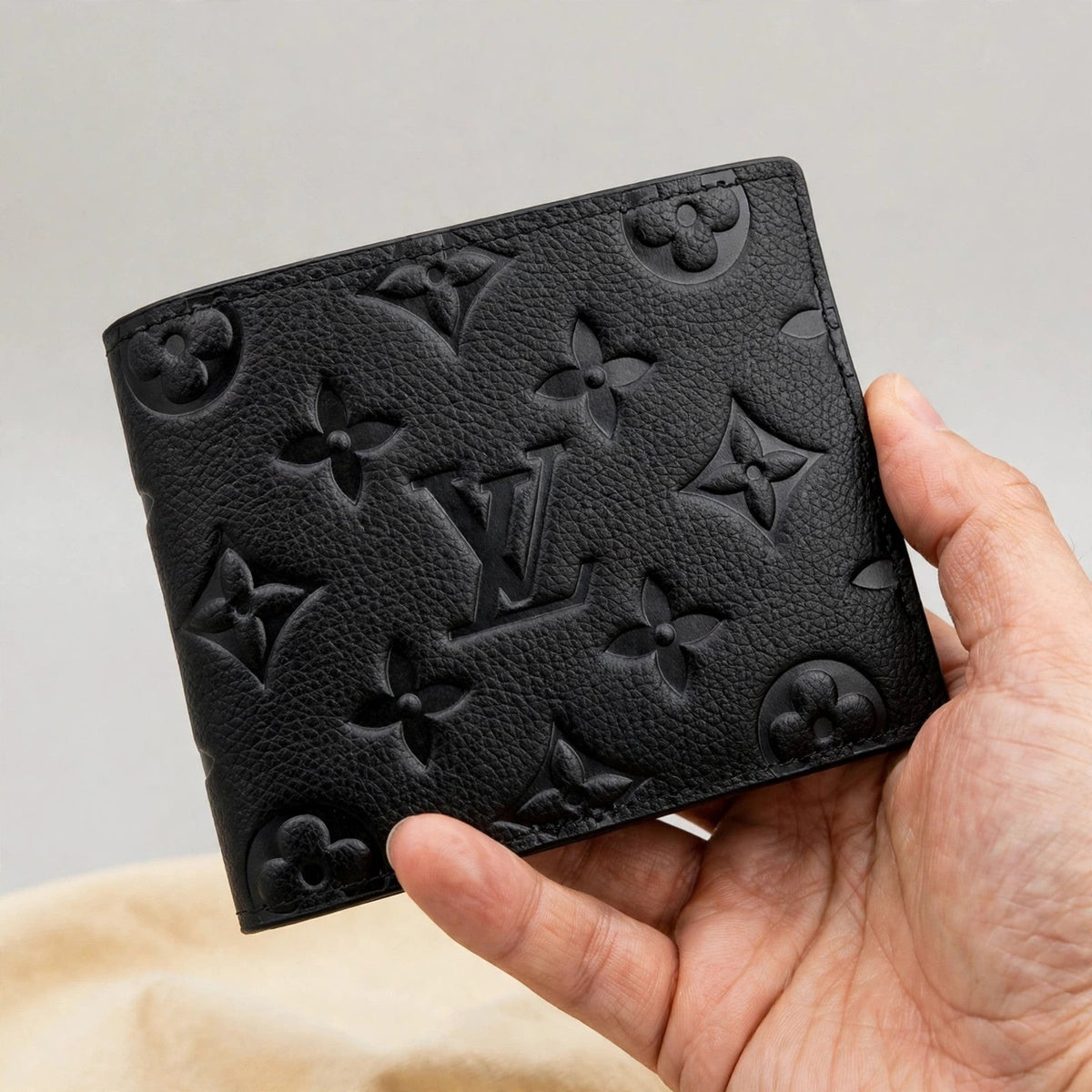 Louis Vuitton Multiple Monogram Wallet – Men's Slender Canvas — hand product photo