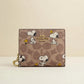 Coach x Peanuts Snap Wallet – Signature Canvas Snoopy Print — cream product photo