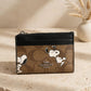 Coach x Peanuts Mini Skinny ID Case – Signature Canvas Snoopy Print — warm product photo