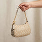 Coach Teri Shoulder Bag – Signature Canvas for Women — hand product photo