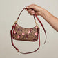 Coach Teri Shoulder Bag – Signature Canvas Cherry Print — hand product photo