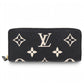 Louis Vuitton Portefeuille Clémence bicolor Empreinte wallet on white background