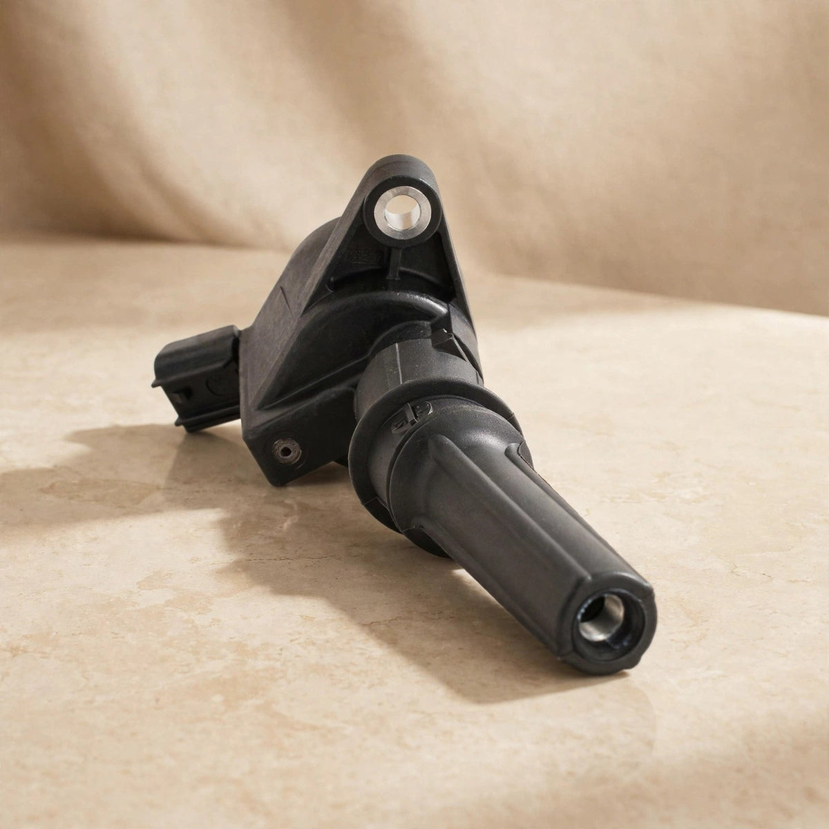 Motorcraft DG508 ignition coil in warm beige studio