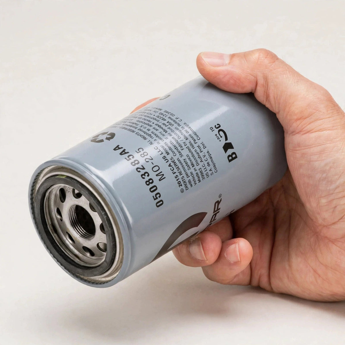 Hand holding the Mopar MO-285 oil filter