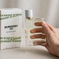 Burberry Her Eau de Toilette 100ml for Women — hand holding bottle