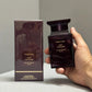 Tom Ford Oud Voyager Eau de Parfum 100ml Unisex — hand holding bottle