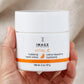 Hand holding Image Skincare Vital C Hydrating Repair Creme jar