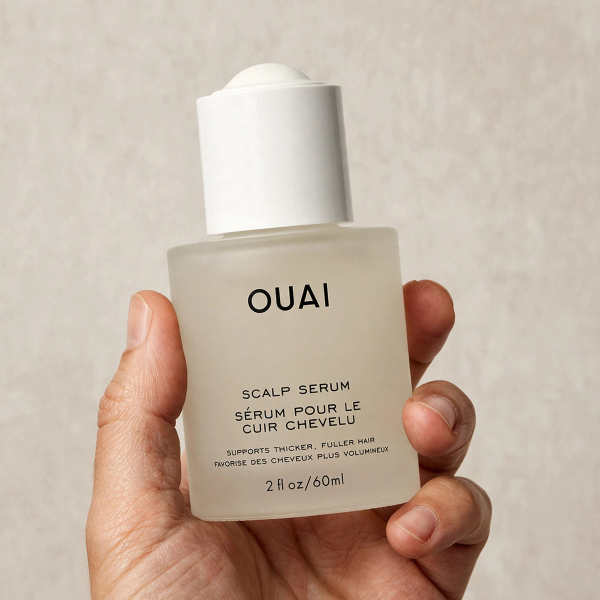 OUAI Scalp Serum 2 fl oz – hand image