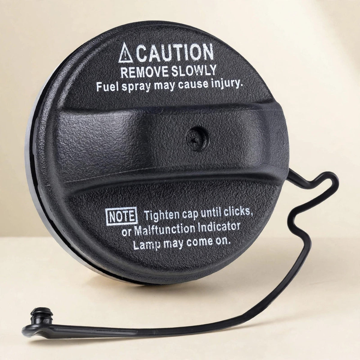 Toyota 77300-33070 fuel tank gas cap in a cream studio setting