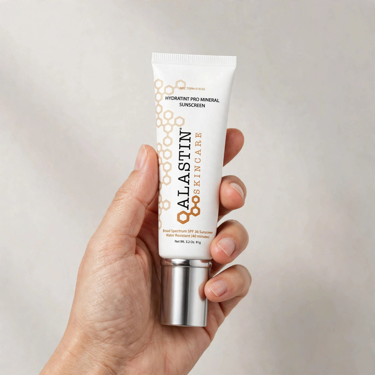 Alastin HydraTint Pro Mineral Sunscreen SPF 36 3.2 oz – hand image
