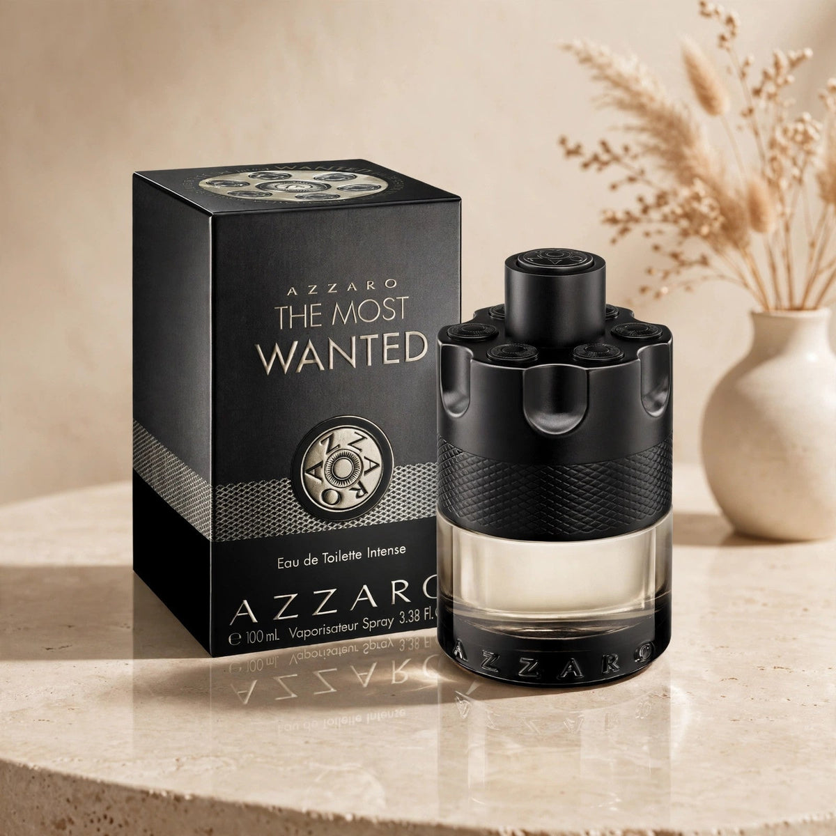 Azzaro The Most Wanted Eau de Toilette Intense 100ml / 3.4oz for Men bottle and box in warm beige studio